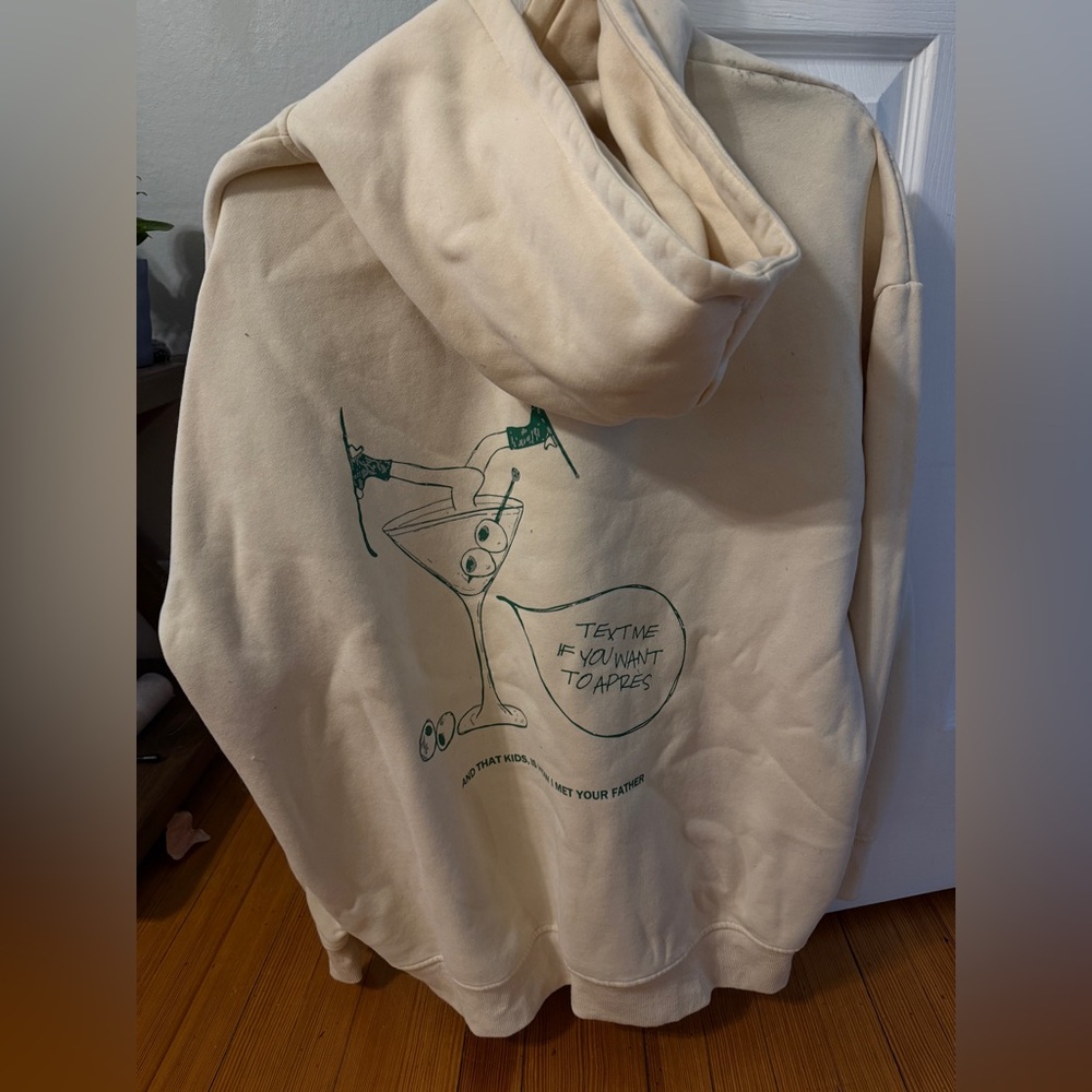 Rebellious Ski Club Apres Cream Hoodie with Martini Graphic